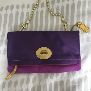 Coach clutch with strap